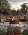 A rustic backyard featuring a central corten steel fire pit, surrounded by natural stone pavers and chunky cedar log benches. Distressed terracotta pots overflow with coneflowers and lavender, while a vintage galvanized tub holds succulents, all under the soft glow of string lights. — view 4