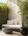 A small Japandi backyard featuring a low-profile teak bench with off-white cushions, a round grey stone side table, and a tall bamboo plant in a black ceramic planter, all set on light wood decking. — close-up of textures and materials