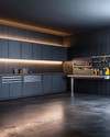 A modern minimalist garage featuring matte charcoal gray flat-panel cabinets, polished concrete flooring, integrated LED strip lighting, and a stainless steel workbench with organized tools on a dark slat wall. — alternate angle
