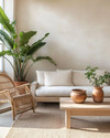 A Japandi sunroom blending vintage and modern elements, featuring a low-profile natural linen sofa, a restored vintage rattan chair, and a light wood coffee table with ceramic vessels. Large green plants in simple terracotta pots add organic life, all under abundant natural light. — close-up of textures and materials