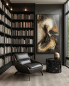 A modern library featuring floor-to-ceiling matte black bookshelves filled with books, a low-profile charcoal leather armchair, a black marble side table, and a large abstract art piece on a wall painted in Benjamin Moore's Gray Owl, with warm task lighting. — alternate angle