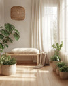 A bright Scandinavian sunroom featuring light oak flooring, a minimalist birch wood bench, and a rattan pendant light. Natural linen curtains filter the sunlight, while a faux sheepskin throw and various green plants in unglazed ceramic pots add texture and life.