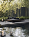 A serene Japandi pool area featuring a dark-tiled swimming pool surrounded by smooth concrete pavers and a low-slung teak daybed with charcoal cushions. Subtle solar-powered lanterns glow amidst pet-friendly green groundcover and slender bamboo plants.