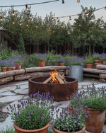 A rustic backyard featuring a central corten steel fire pit, surrounded by natural stone pavers and chunky cedar log benches. Distressed terracotta pots overflow with coneflowers and lavender, while a vintage galvanized tub holds succulents, all under the soft glow of string lights. — view 3