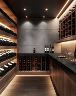 Modern wine cellar with warm grey walls, rift-sawn oak wine racks, and a honed black granite tasting counter. Integrated LED strip lighting illuminates the wine bottles, while recessed spotlights provide ambient glow. — styling and décor detail