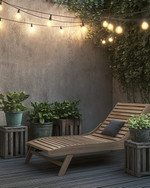 A Scandinavian patio featuring a blend of modern and vintage elements, with a slatted teak lounge chair, a weathered wooden crate side table, and antique ceramic planters filled with green foliage, all under the soft glow of Edison bulb string lights. — alternate angle