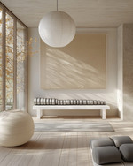 A serene Japandi home gym with abundant natural light from a large window, light ash wood flooring, a minimalist white bench, a simple paper lantern pendant light, and a collection of yoga mats in soft grey and beige. — alternate angle