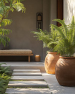 A serene Japandi-style driveway featuring large unglazed terracotta planters with lush green ferns, smooth concrete stepping stones, and subtle solar-powered pathway lights casting a warm glow. A simple wooden bench with a woven cushion sits near the entrance, embodying natural textures and minimalist design. — alternate angle