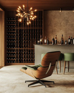 Mid-Century Modern wine cellar featuring a walnut Eames Lounge Chair, a Sputnik chandelier, sleek teak wine racks, and a concrete tasting bar with green upholstered stools. — close-up of textures and materials
