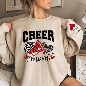Cheer Mom I Wear My Heart On My Sleeve Sweatshirt, Custom Mama Sweatshirt With Kids Names | Mazezy