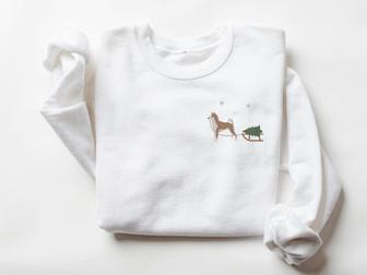 Embroidered Sweatshirt, Shiba Inu Harvesting A Christmas Tree For Christmas | Mazezy