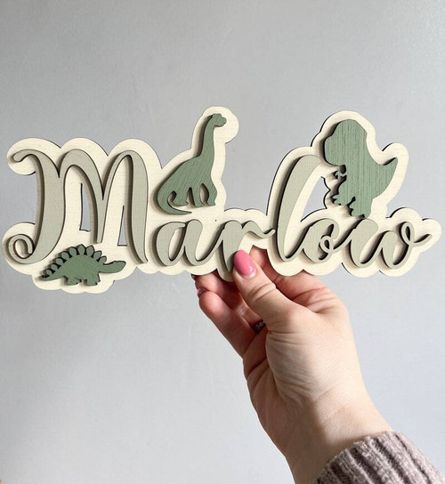 Custom dinosaur nursery name sign in natural wood with dinosaur silhouettes, personalized for baby boy boys' bedroom wall decor | Family Wall Decor