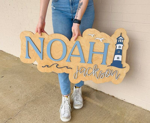 Nautical nursery wood sign with layered custom name, ocean-themed accents, personalized wall decor for baby's room | Family Wall Decor