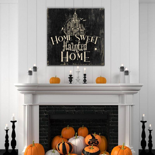 Rustic Halloween canvas with 'Home Sweet Haunted Home' script, bats and cobwebs on distressed wood for spooky mantel decor | Family Wall Decor DE