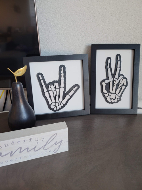 Skeleton peace and love sign layered in black acrylic on natural wood, Halloween wall decor, 3D detail for entryway display | Familywalldecor
