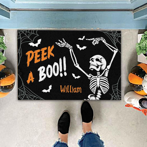 Skeleton Halloween door mat with peekaboo design, personalized with family name for outdoor front porch fall decor. | Familywalldecor