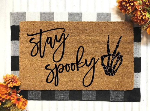 Halloween skeleton doormat with 'Stay Spooky' text, funny rectangular welcome mat for fall front porch decor and entryway | Familywalldecor