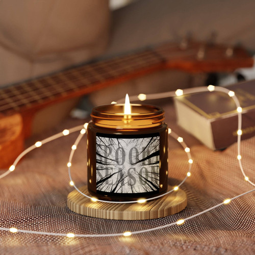 Spooky season soy wax candle in amber jar, gothic fall decor accent with warm glow for a cozy Halloween home ambiance | Familywalldecor