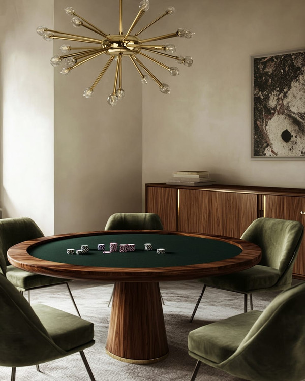 A mid-century modern game room featuring a walnut poker table with a dark green felt top, surrounded by olive velvet low-slung armchairs, illuminated by a brass Sputnik chandelier, with a teak credenza against a soft ivory wall.