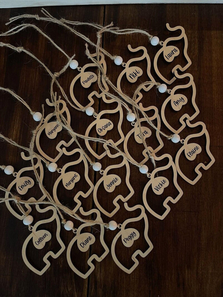 Elephant family ornament in maple wood for home decor, honoring sisterhood and friendship, with sentiment card and pouch.