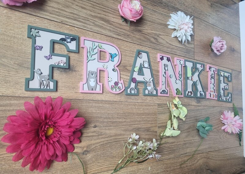 Woodland nursery animal wood sign letters in natural maple, personalized name with raccoon and hedgehog, above crib