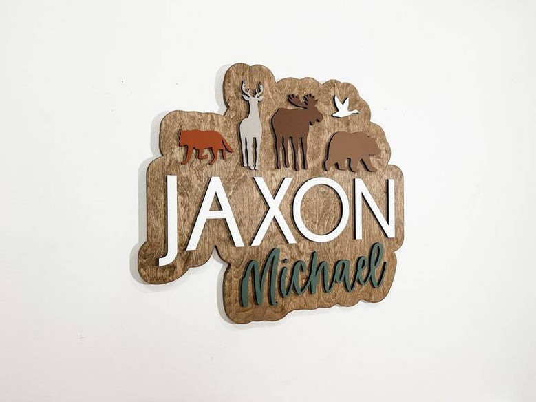 Woodland wildlife 3D wood name sign, personalized for baby’s room with layered wood and forest accents; baby shower gift