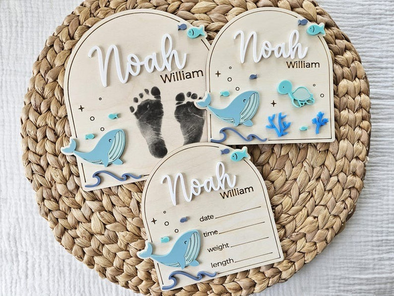 Whale nursery wood sign, personalized round engraved plaque for baby announcement or newborn footprint display in ocean theme