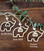 Elephant family ornament crafted in natural maple wood, a friendship keepsake with card and pouch for thoughtful gifting.
