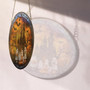 Spooky Halloween ghost family stained glass suncatcher, iridescent whites and amber glass, seasonal living room window decor