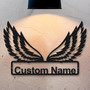 Angel wings metal wall decor featuring cutout custom name, thoughtful gift for new homeowners, ideal for living room