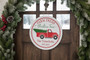 Funny Jolliest Bunch Christmas Round Wood Sign with Red Truck